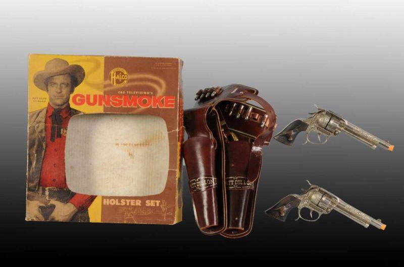 Appraisal: Halco Gunsmoke Diecast Toy Cap Gun Holster Set Description Includes