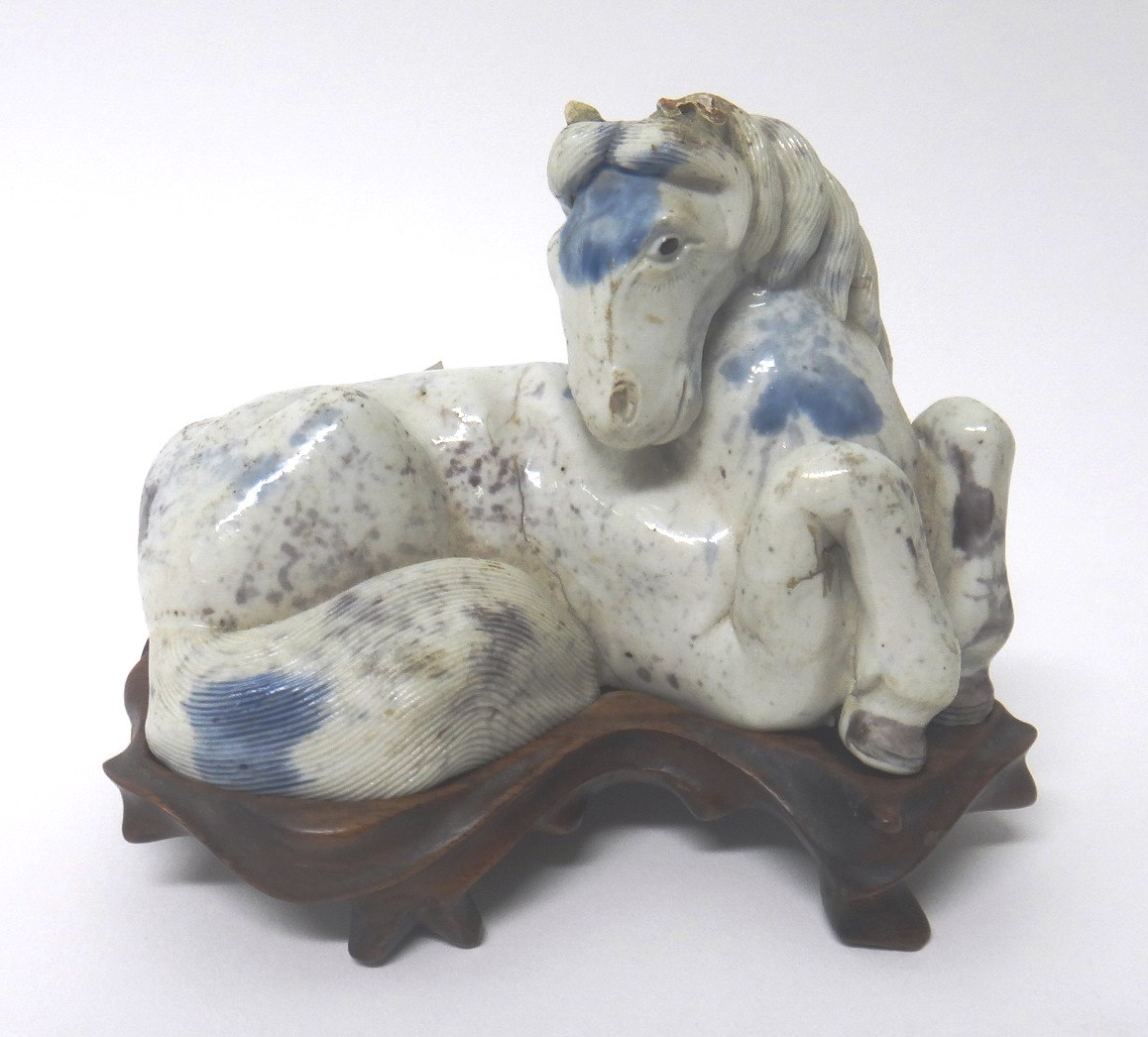 Appraisal: A Chinese porcelain figure of a recumbent horse probably th