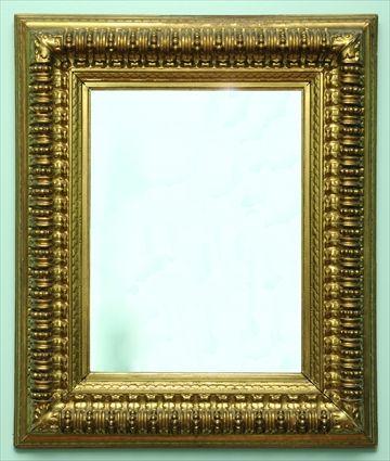 Appraisal: RENAISSANCE-STYLE CARVED GILTWOOD WALL MIRROR The rectangular mirror plate in