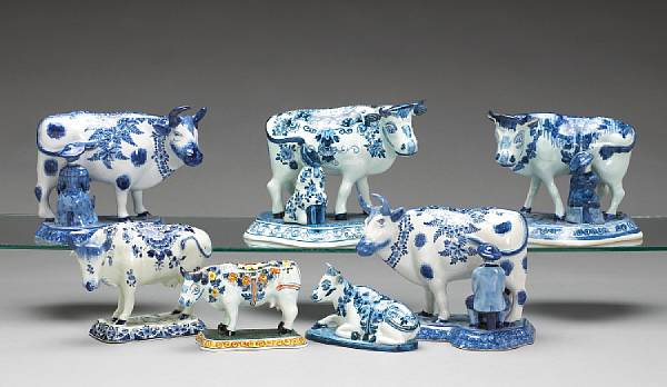 Appraisal: Seven Dutch blue and white or polychrome Delft cows th