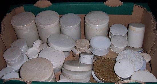 Appraisal: A large quantity of ointment and cream jars and covers