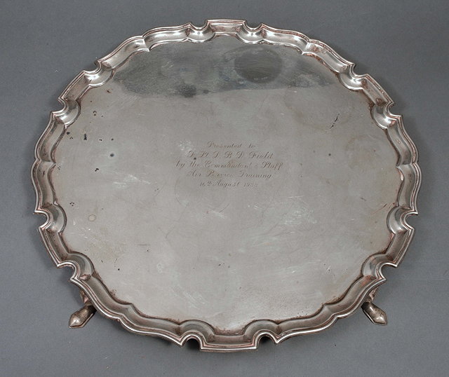 Appraisal: A SILVER PRESENTATION TRAY with a Chippendale border and on