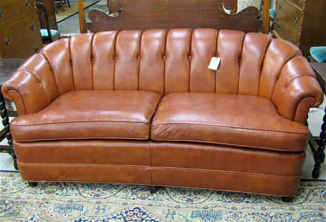 Appraisal: MODERN LEATHER SOFA American recent manufacture with overall rust leather