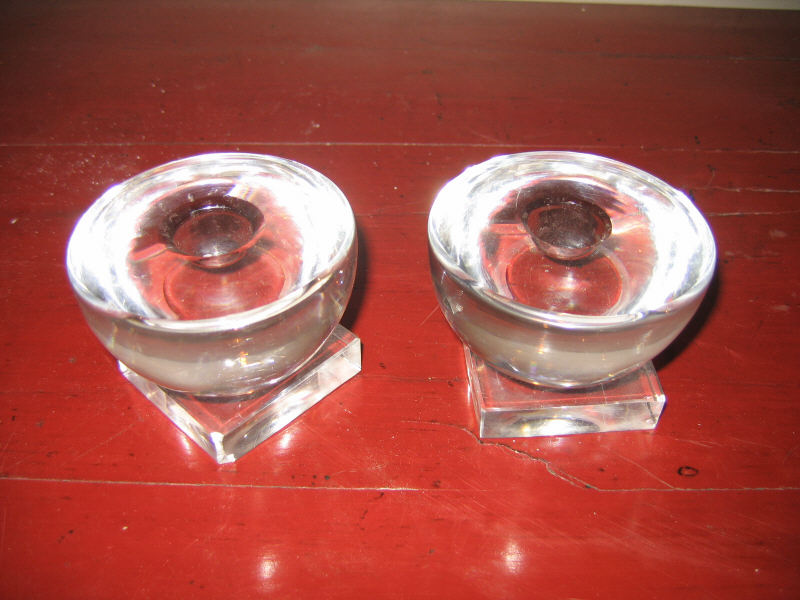 Appraisal: LIBBEY pair of half-spherical glass candlesticks on square pedestal supports