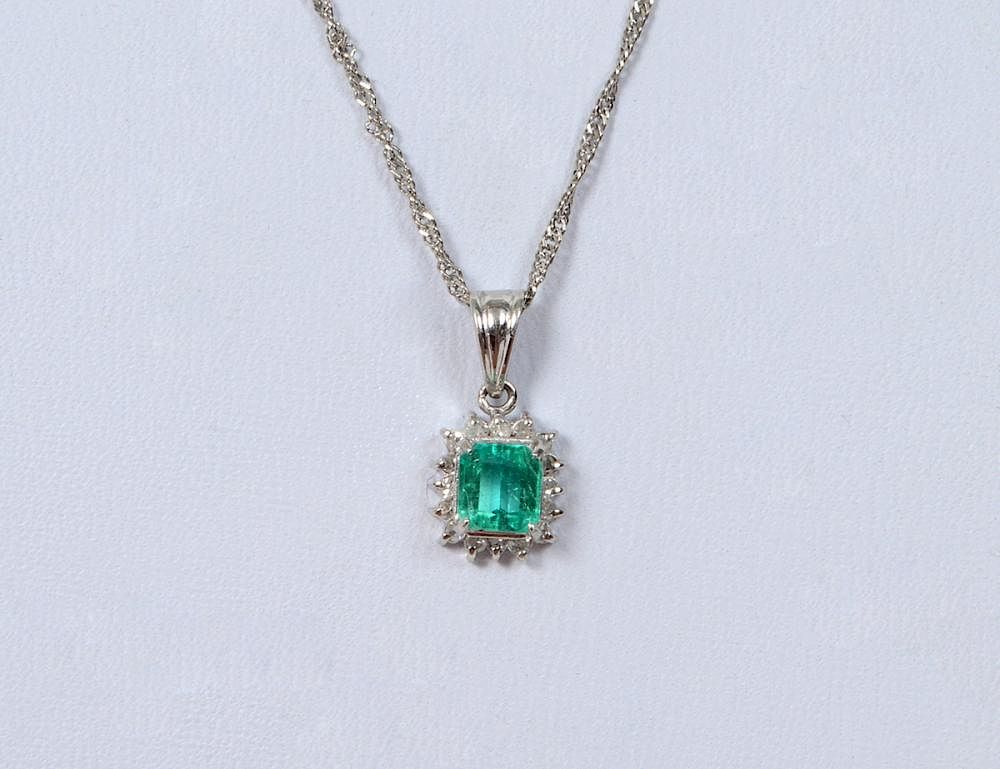 Appraisal: EMERALD AND DIAMOND PENDANT Set with one approximately carat emerald