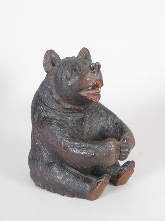 Appraisal: A seated Black Forest Bear with hinged head and glass