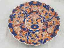 Appraisal: A large th Century Imari charger with scalloped rim and