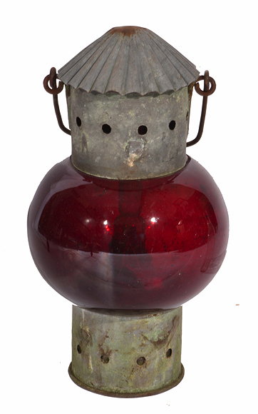 Appraisal: AN OLD LANTERN with spherical red glass and carrying handle