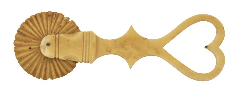 Appraisal: WHALE IVORY PIE CRIMPER WITH OPEN-CARVED HEART MID- TH CENTURY