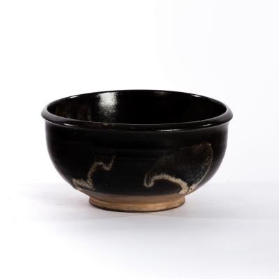 Appraisal: Studio Pottery a black glaze bowl with pale patches cm