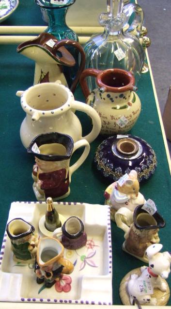 Appraisal: A Madina bottle vase three Torquay pottery jugs a Doulton