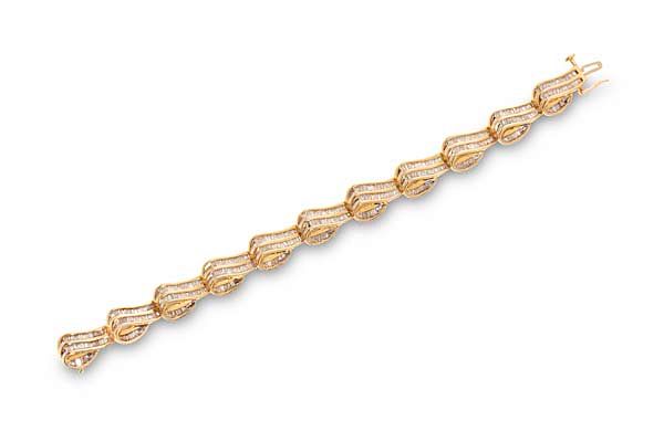 Appraisal: A diamond and fourteen karat gold bracelet A diamond and