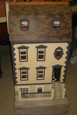 Appraisal: A painted wood dolls house modelled as a four storey