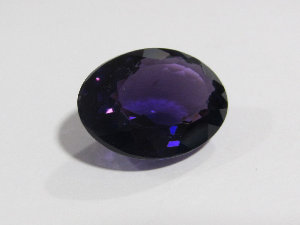 Appraisal: An oval unmounted amethyst of fine colour approximately carats