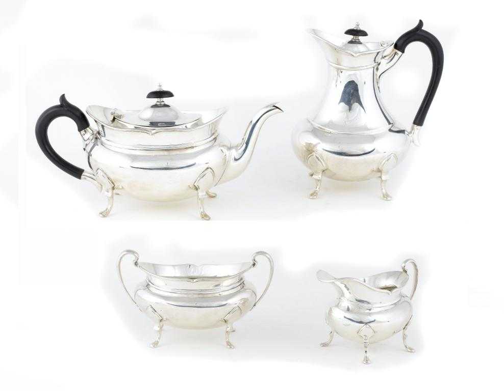 Appraisal: A GEORGE V TEA AND COFFEE SERVICE of compressed oval