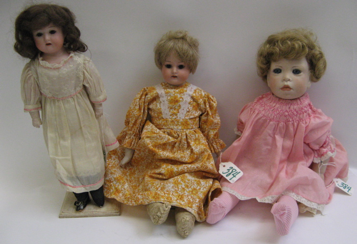 Appraisal: THREE BISQUE HEAD GIRL DOLLS One by Heubach Koppelsdorf bisque