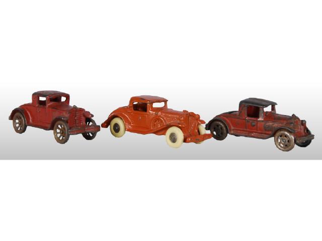 Appraisal: Lot of Red Cast Iron Coupe Cars Description Coupes with