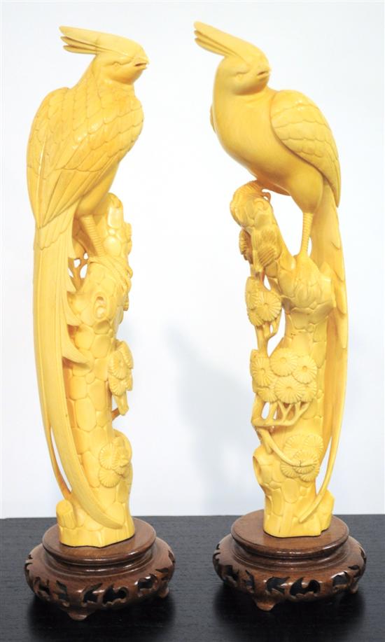 Appraisal: Pair of Asian craved ivory figures of birds perched on