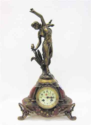 Appraisal: FRENCH ART NOUVEAU GILT BRONZE FIGURAL CLOCK Red mottled marble