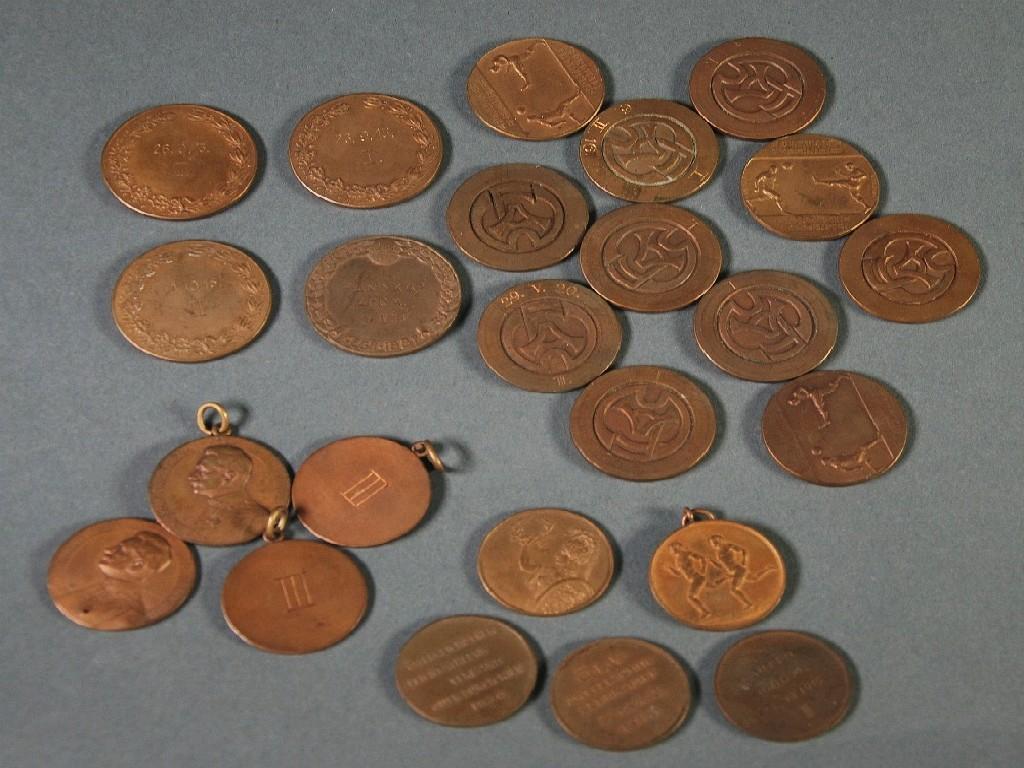 Appraisal: TWENTY FOUR GERMAN AUSTRIAN EARLY TH BRONZE SPORTING MEDALLION eleven