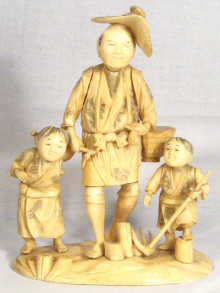 Appraisal: A sectional ivory group of a Chinese figure with his