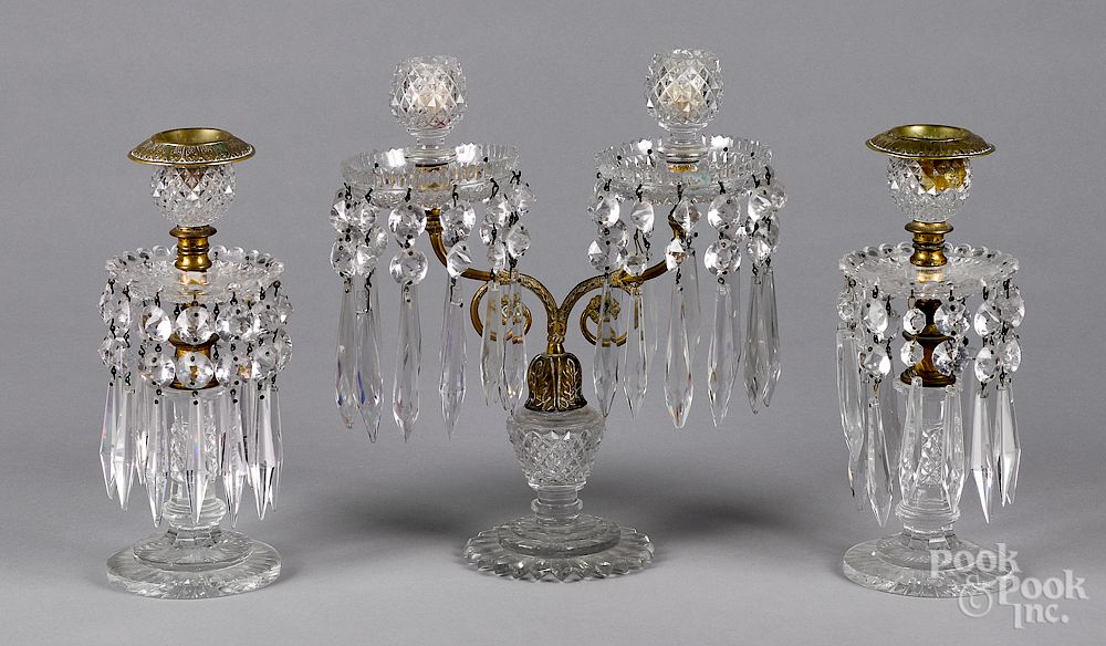 Appraisal: Flint glass and brass three-piece candelabra set Exclusive on Bidsquare