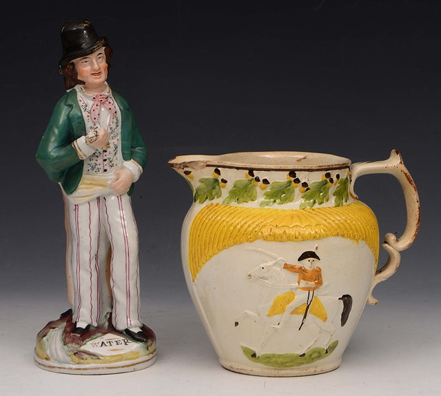 Appraisal: A STAFFORDSHIRE POTTERY DOUBLE SIDED FIGURE of Gin and Water