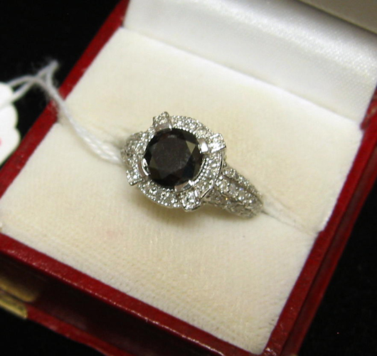 Appraisal: BLACK DIAMOND AND FOURTEEN KARAT WHITE GOLD RING WITH APPRAISAL