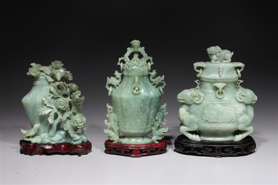 Appraisal: Group of three Chinese elaborately carved hardstone covered vases with