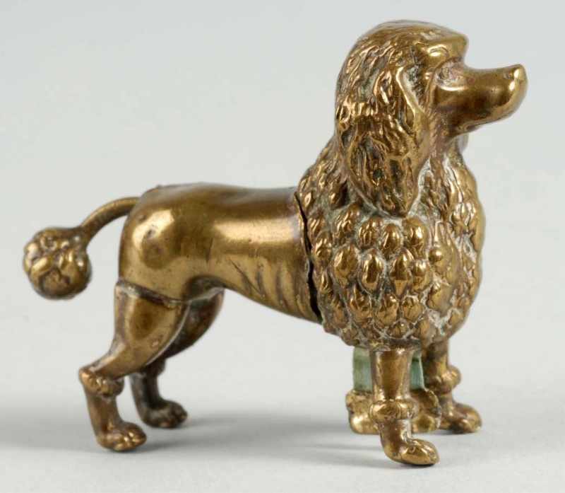 Appraisal: Poodle Figural Tape Measure Description Brass Tape wound by tail