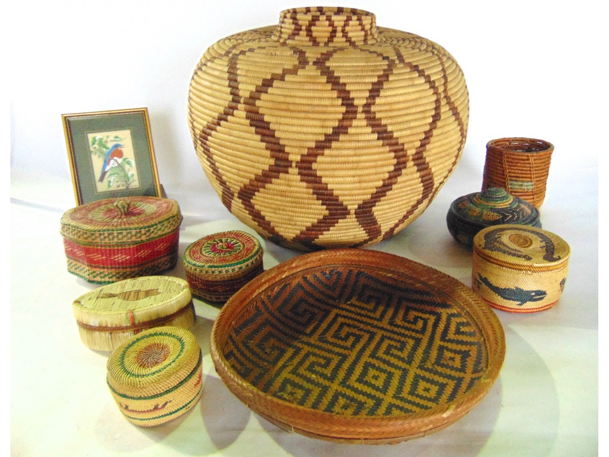 Appraisal: A selection of decorative stained wicker worked woven grass boxes