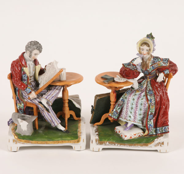 Appraisal: Pair of German fine pocelain male and female seated figures