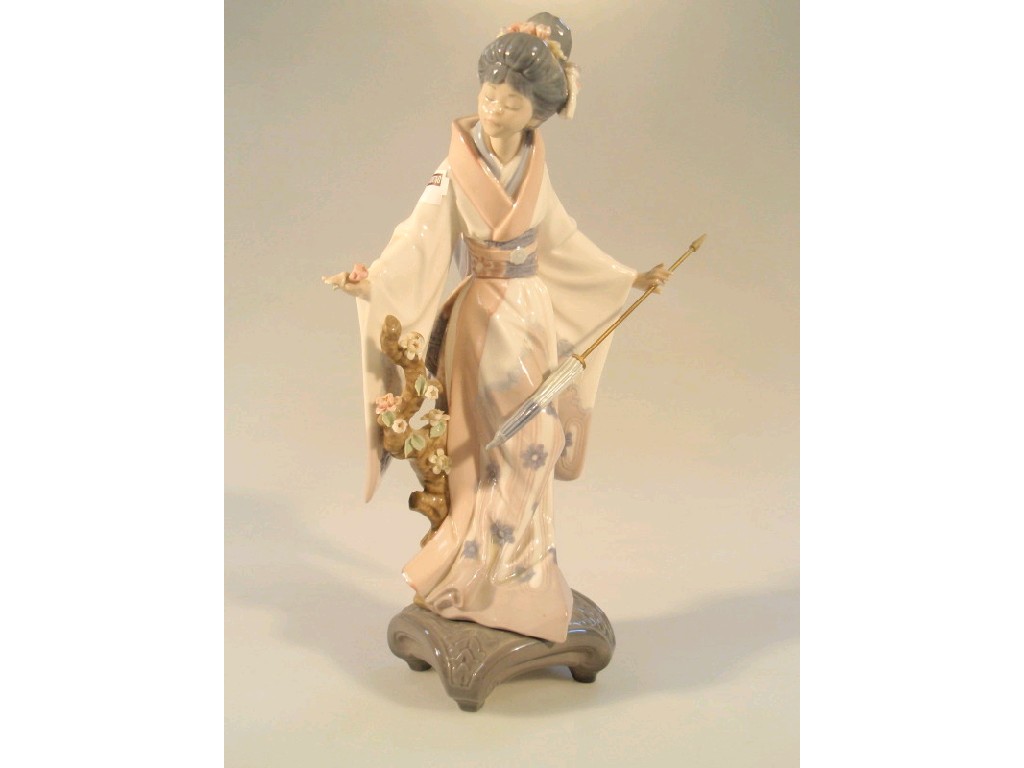 Appraisal: A Lladro figure of a Geisha with a parasol picking