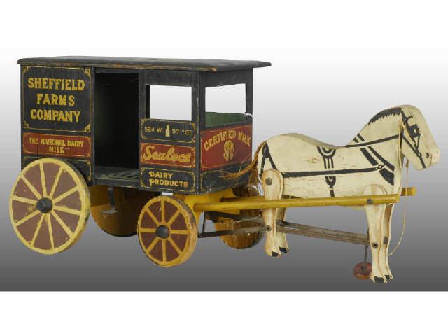 Appraisal: Sheffield Sealtest Horse-Drawn Milk Wagon Toy Description Wood Minor paint