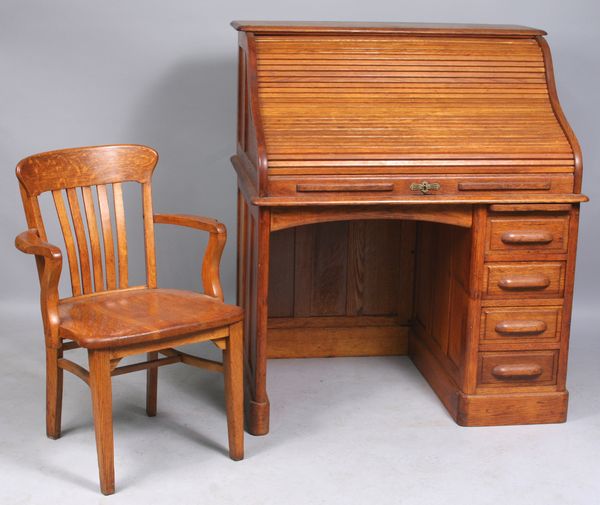 Appraisal: C golden oak roll-top desk and chair having partitioned interior