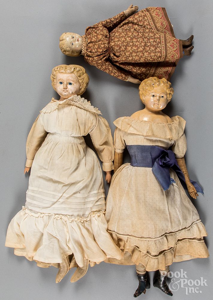 Appraisal: Three Greiner type papier-m ch molded hair dolls Three Greiner