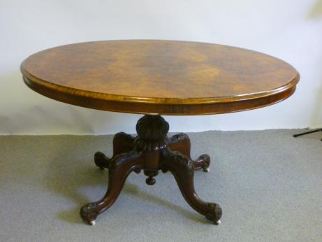 Appraisal: A VICTORIAN WALNUT LOO TABLE the moulded edged quarter veneered