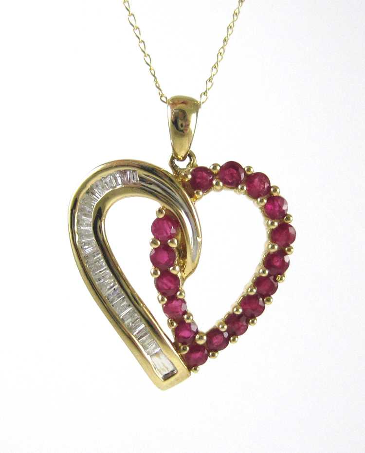 Appraisal: RUBY DIAMOND AND FOURTEEN KARAT GOLD PENDANT NECKLACE with a