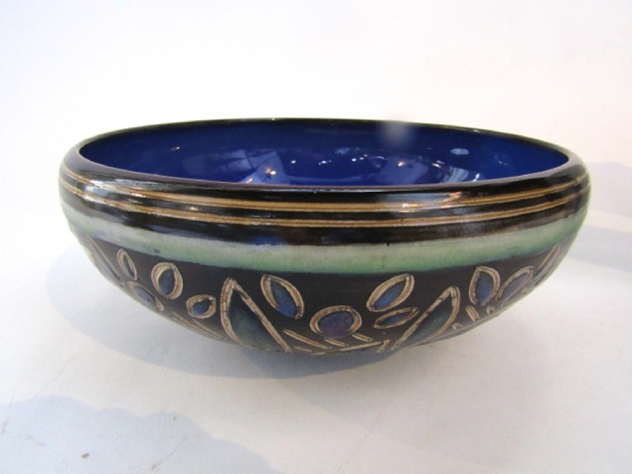 Appraisal: A Royal Doulton bowl with incised and painted stylised leaf