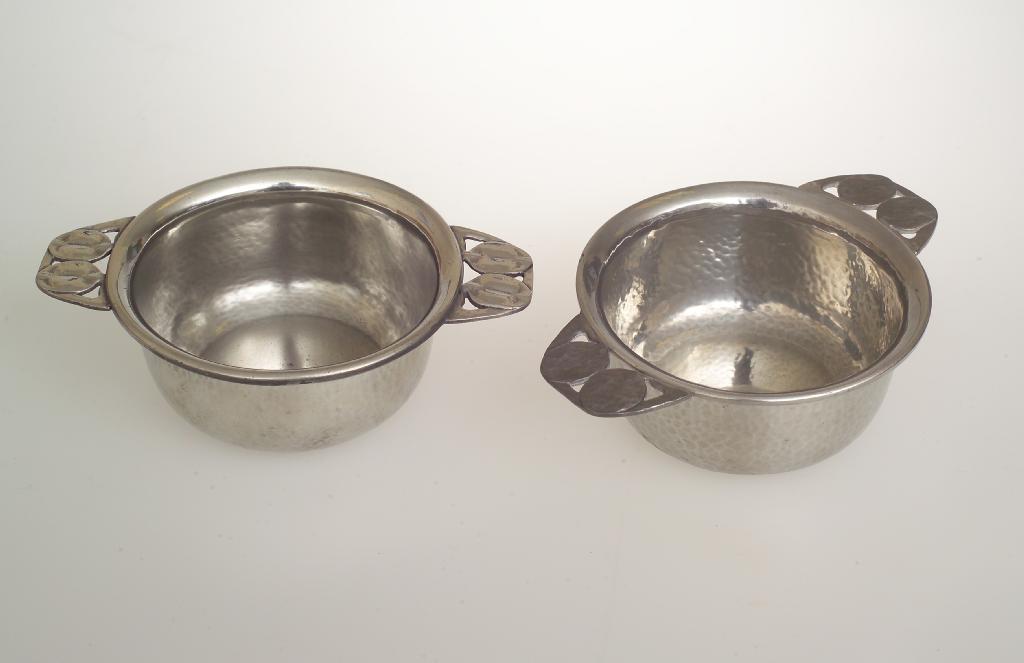 Appraisal: NEAR PAIR OF LIBERTY CO TUDRIC PEWTER PORRINGERS POSSIBLY DESIGNED