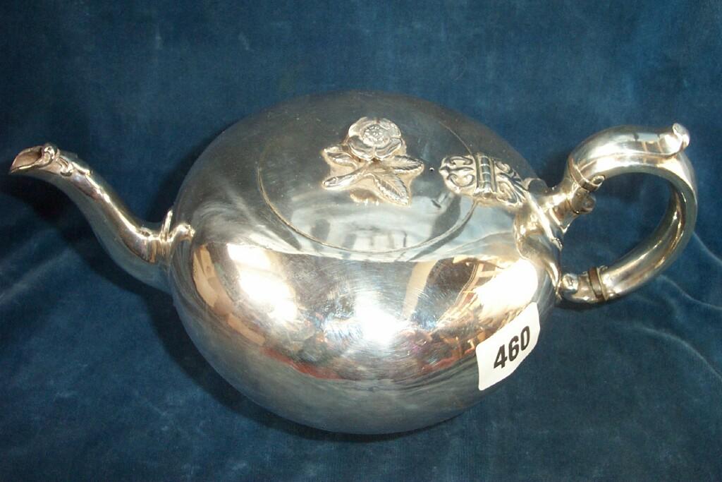 Appraisal: A Victorian silver teapot of melon shaped form with shaped