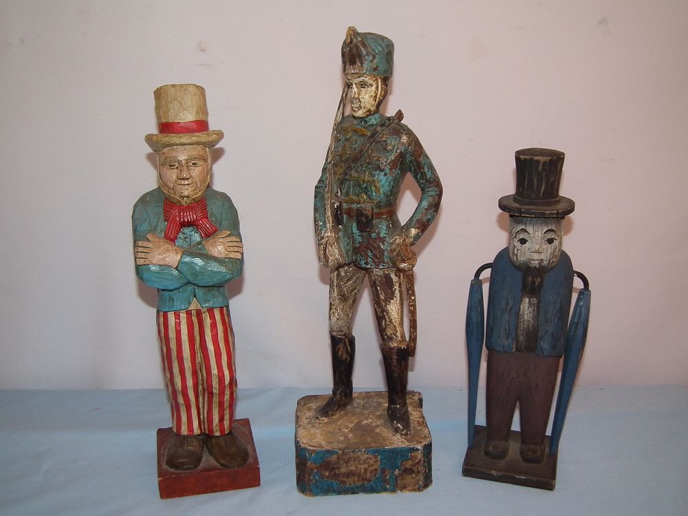 Appraisal: WOOD FOLK ART FIGURES Lot of carved and painted wood