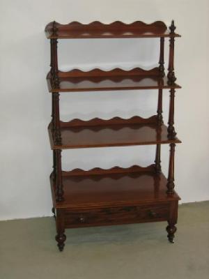 Appraisal: A VICTORIAN MAHOGANY WHATNOT of oblong form with four graduated