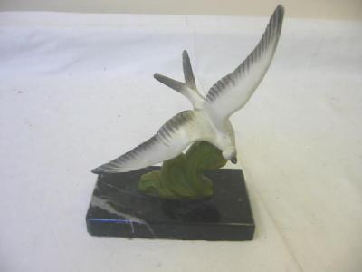 Appraisal: AN ART DECO SPELTER FIGURE modelled as a bird in