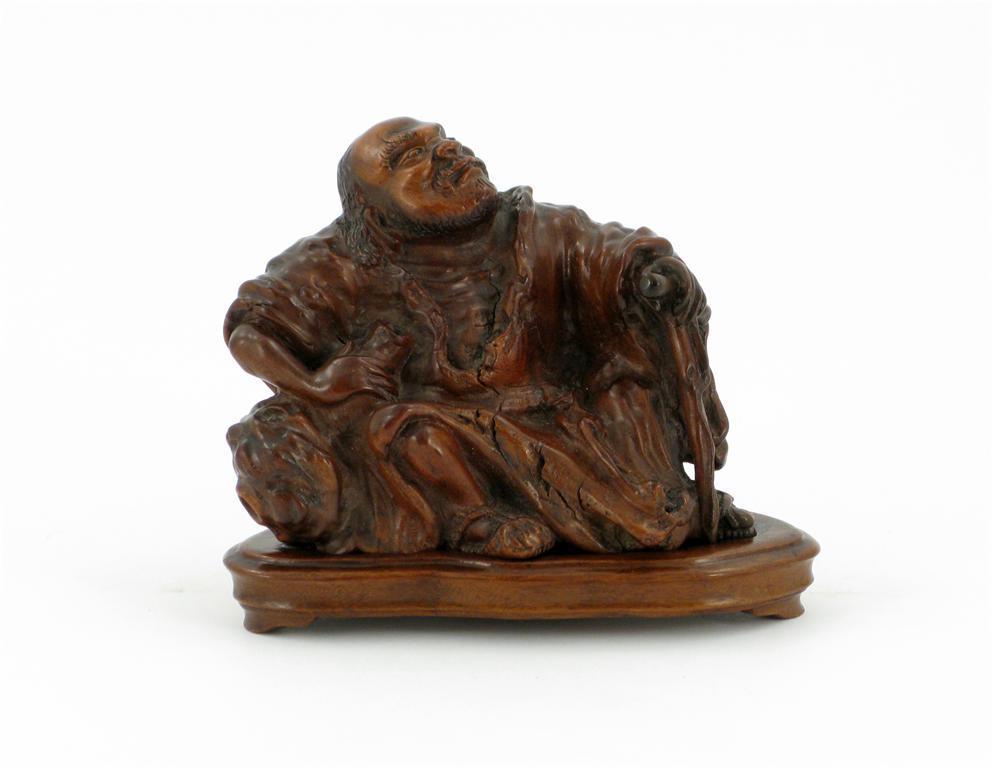 Appraisal: A Chinese hardwood carving of the Immortal Li Tieguai