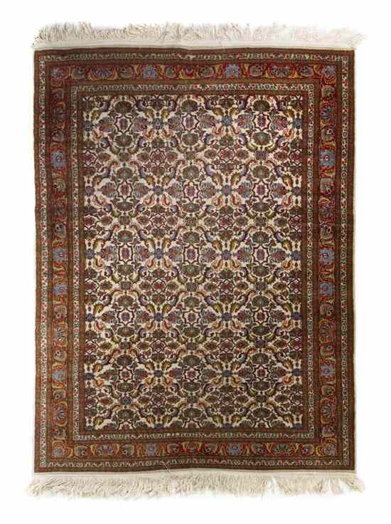 Appraisal: A Persian Wool Rug having a foliate center medallion with