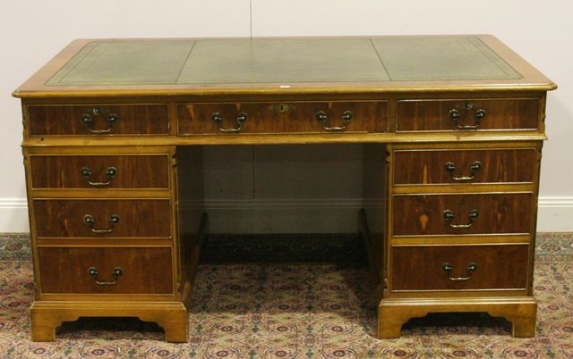 Appraisal: A yew and pine twin pedestal desk cm wide cm