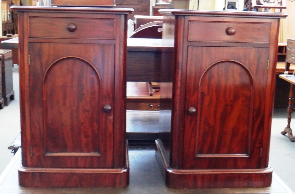 Appraisal: A pair of Victorian mahogany bedside tables each with single