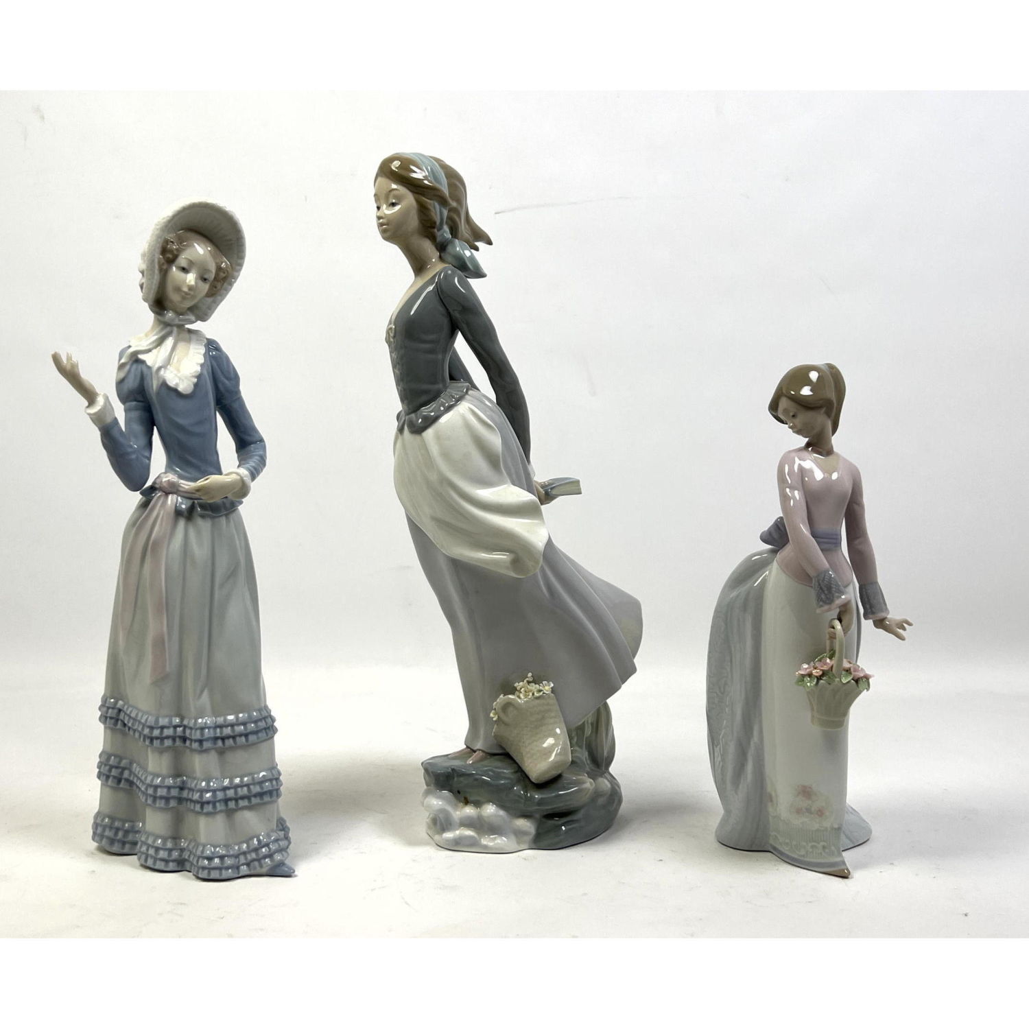 Appraisal: pc Lladro Spain Porcelain Figural Sculptures Each of young girl