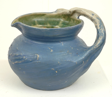 Appraisal: PHILIPPA JAMES Victoria circa Substantial earthenware branch handled jug compressed